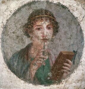 Portrait de jeune femme écrivant avec un stylet sur des tablettes de bois enduites de cire. Fresque, Pompéi